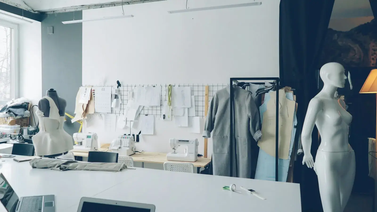Fashion design studio with sketches and sewing materials