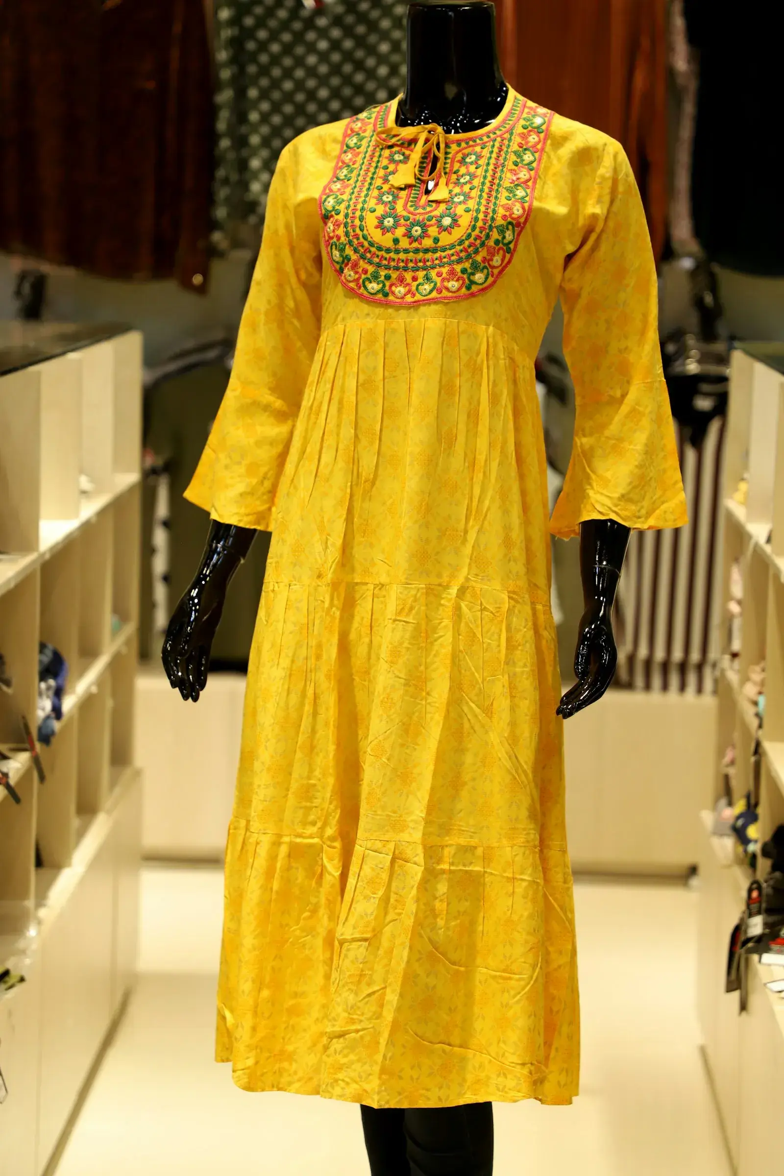 Embroidered neckline on a yellow dress
