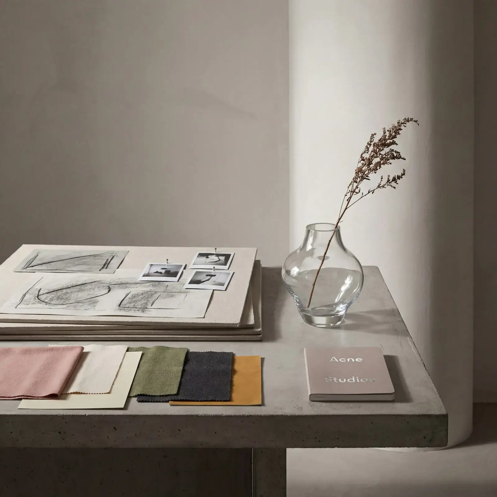 Fabric swatches and sketches on a table