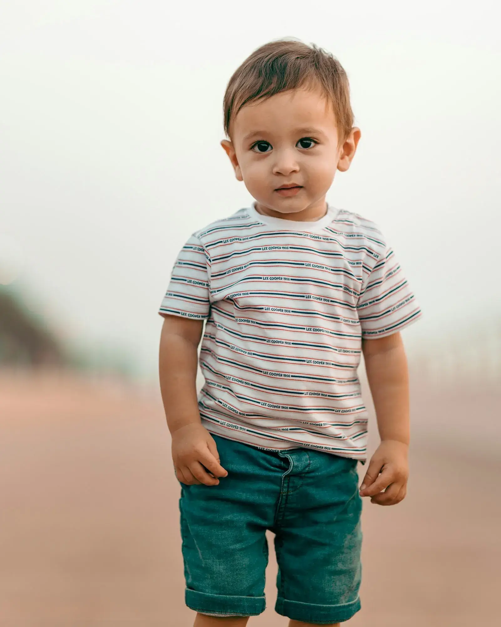 Boy in a striped T-shirt and shorts